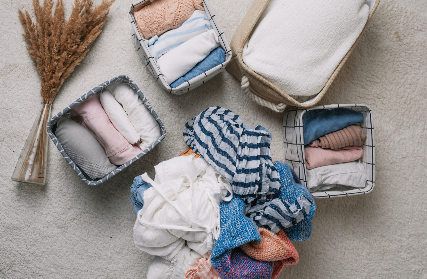 Neatly Folded Clothes in Open Organizer Boxes